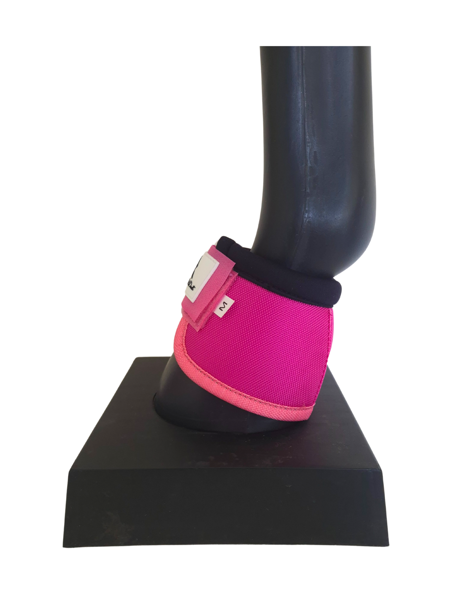 Pink protective boot on a black stand with a white background