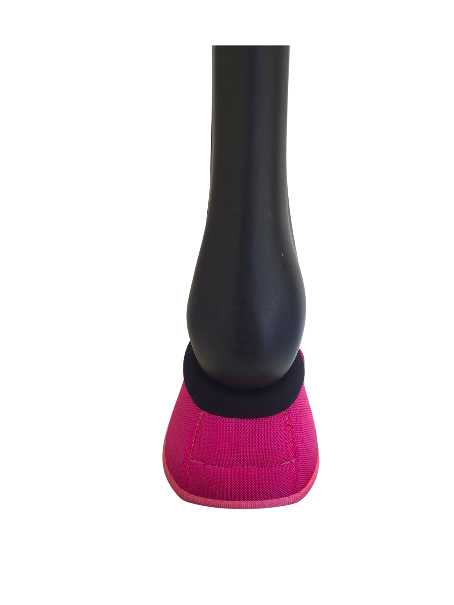 Pink bell boot on plastic horse leg with white background